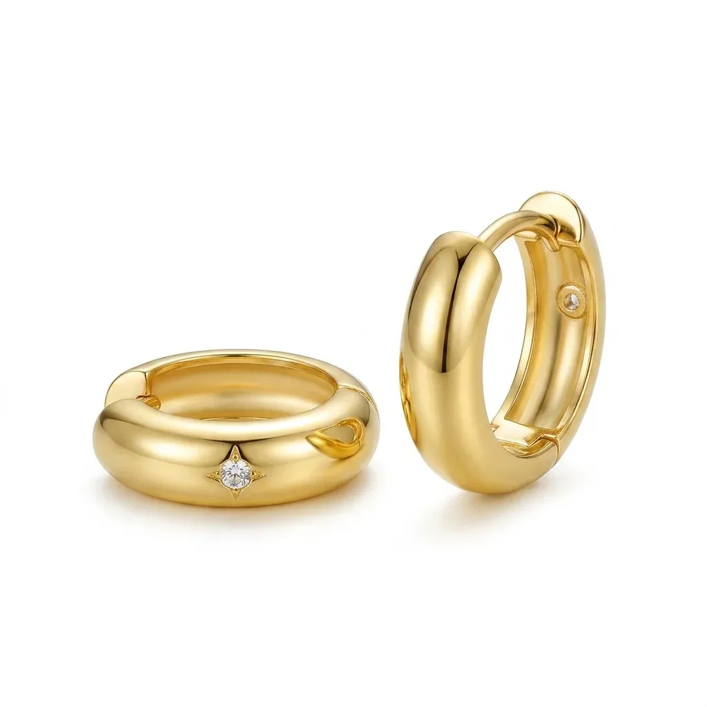 Gold huggie hoop earrings with zircon